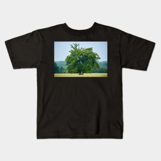 Big old oak tree on a meadow Kids T-Shirt